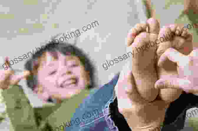 A Parent Gently Tickling Their Baby's Toes 97 Ways To Make A Baby Laugh