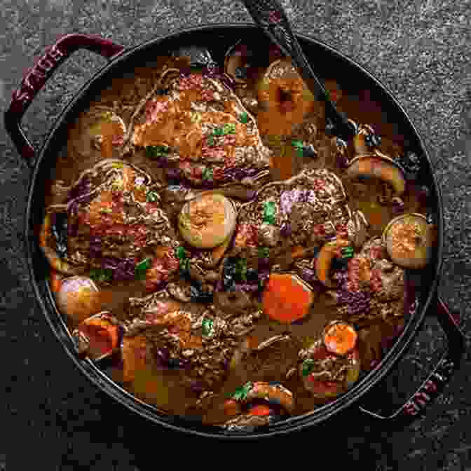 A Plate Of Coq Au Vin, With Tender Chicken Pieces And A Rich Red Wine Sauce World Food: Paris: Heritage Recipes For Classic Home Cooking A Parisian Cookbook