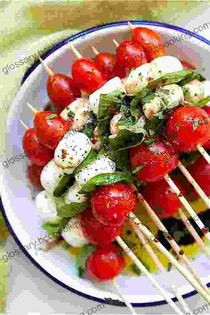 Fresh Mozzarella Balls, Cherry Tomatoes, And Basil Leaves Skewered On A Toothpick, Drizzled With Olive Oil And Balsamic Glaze Ultimate Appetizer Ideabook: 225 Simple All Occasion Recipes