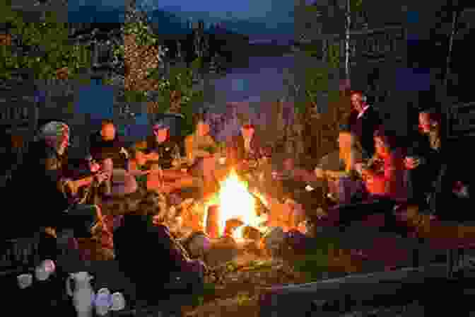 Group Of People Gathered Around A Campfire, Sharing Knowledge And Support A Practical Guide To Off Grid Living In Alaska